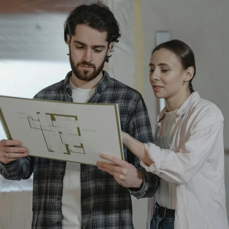 Couple reviewing home renovation plans