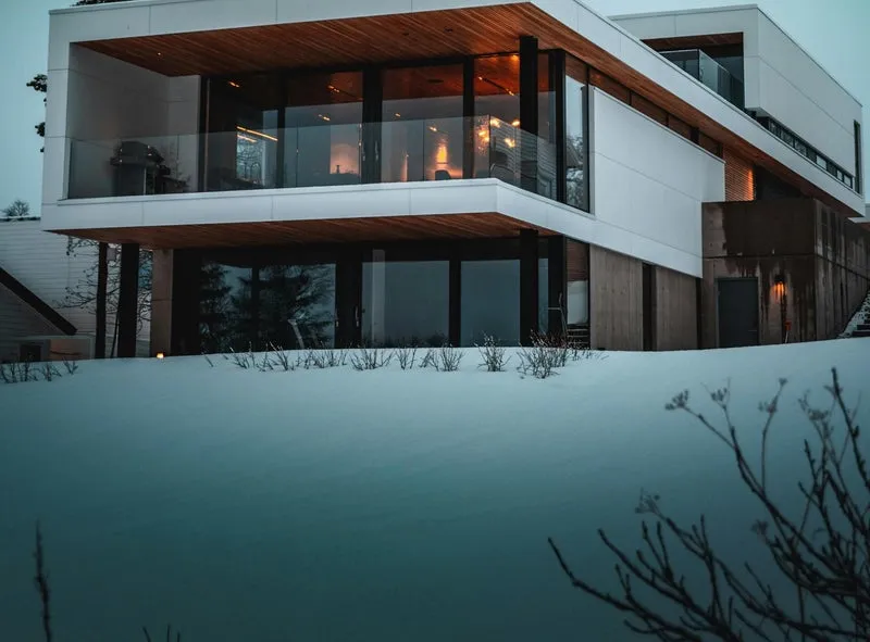 Modern home surrounded by fresh snow